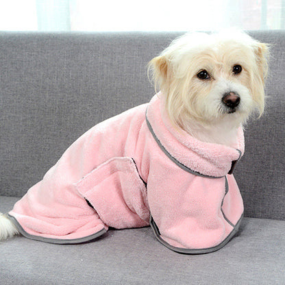 Close-up of a super absorbent dog towel in pink drying off a wet dog.